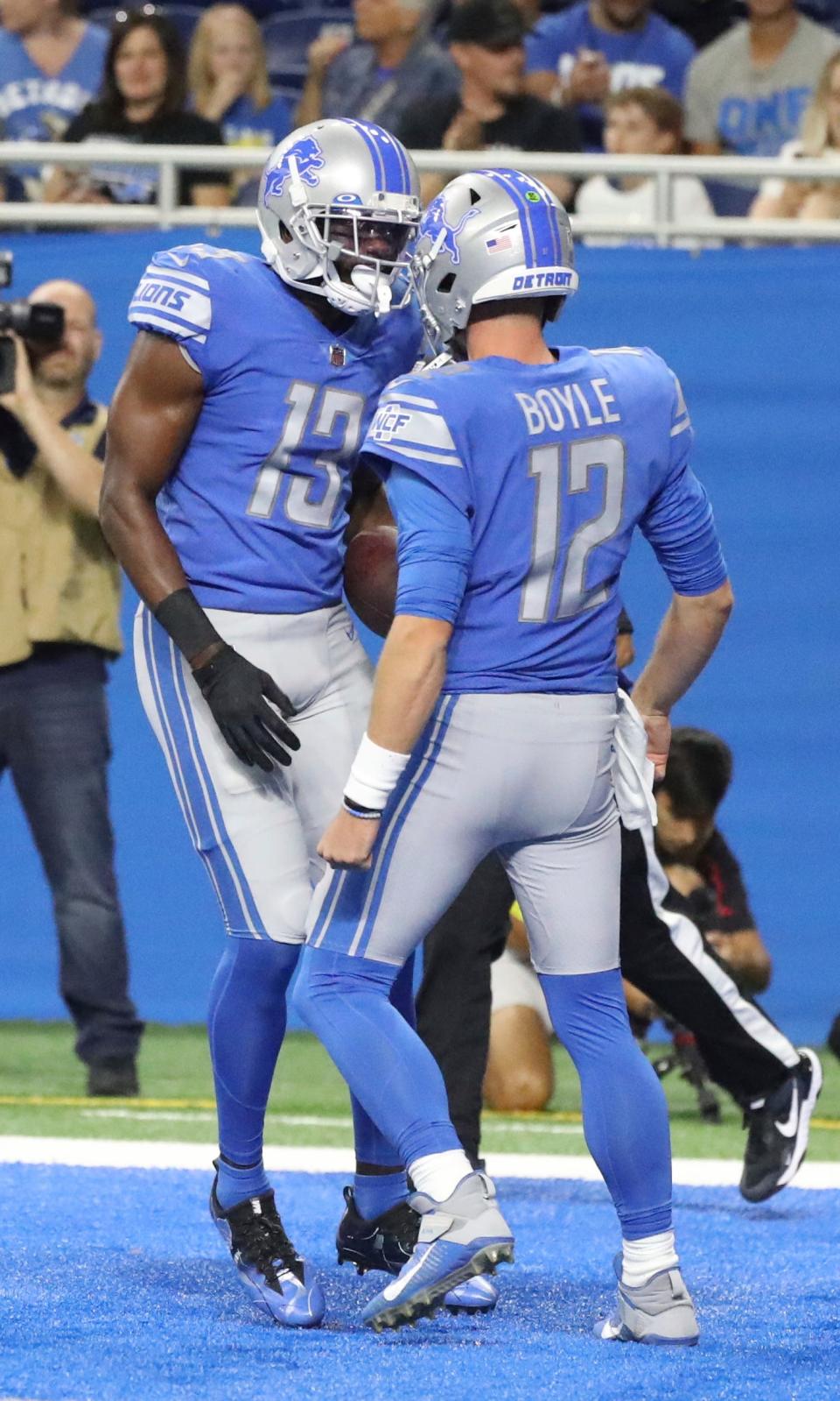 Lions tight end Devin Funchess celebrates his touchdown with quarterback Tim Boyle during the first half of the Lions' 27-23 preseason loss to the Falcons on Aug. 12.