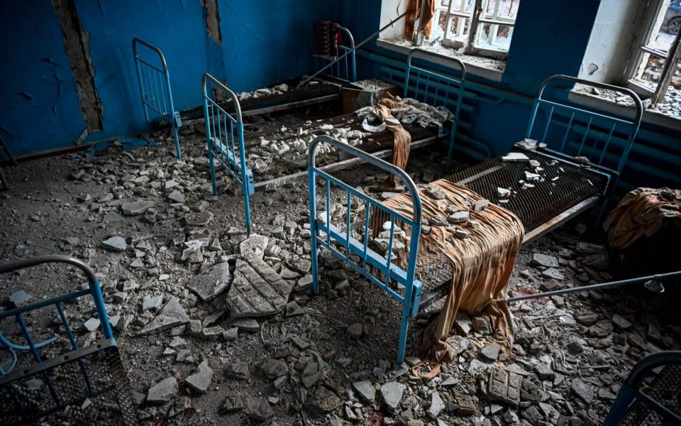 A room in a damaged hospital building in the liberated village of Petropavlivka near Kupiansk, Kharkiv region - SERGEY BOBOK/AFP