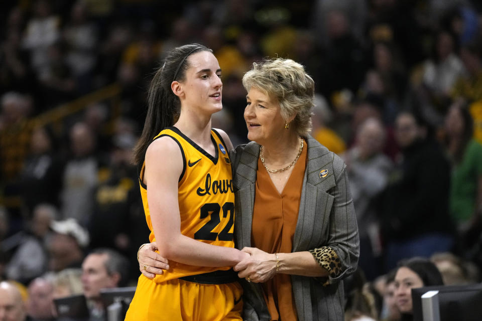 FILE - Iowa head coach Lisa Bluder talks with guard Caitlin Clark (22) in the first half of a first-round college basketball game against Southeastern Louisiana in the NCAA Tournament, Friday, March 17, 2023, in Iowa City, Iowa. LSU is ranked No. 1 in the AP Top 25 preseason women's basketball poll, released Tuesday, Oct. 17, 2023. Iowa was third. (AP Photo/Charlie Neibergall, File)