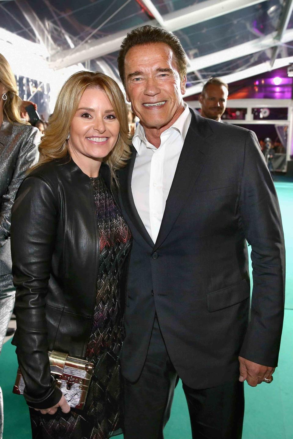 <p>Andreas Rentz/Getty</p> Heather Milligan and Arnold Schwarzenegger in Zurich on Sept. 30, 2015