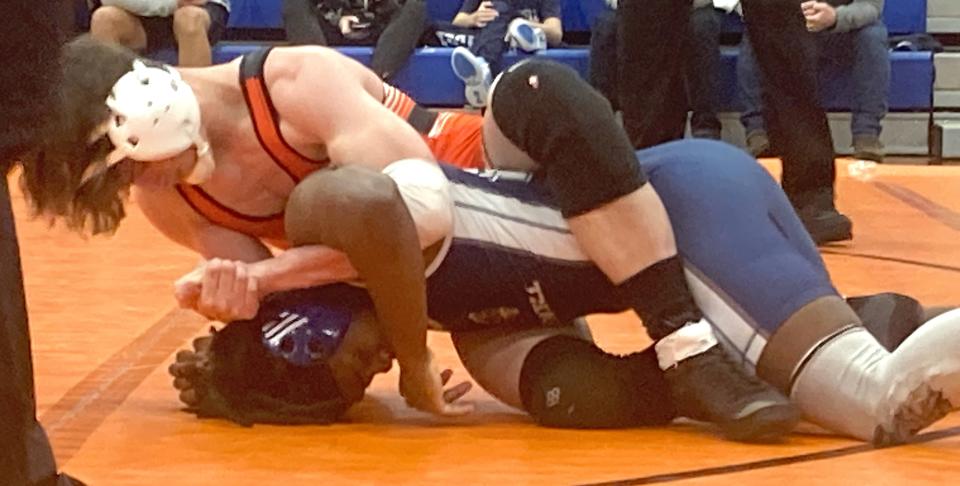 Cathedral Prep wrestler Sam Staab tries to turn McDowell's Javarie Blue in their 139-pound match during Wednesday's Region 5 dual between the Ramblers and Trojans at Joanne Mullen Gymnasium. Staab, who pinned Blue late in the second period, also helped Prep win 43-24.