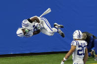 Indianapolis Colts running back Nyheim Hines (21) performs a somersault after a 22-yard run for a touchdown during the first half of an NFL football game against the Detroit Lions, Sunday, Nov. 1, 2020, in Detroit. (AP Photo/Carlos Osorio)