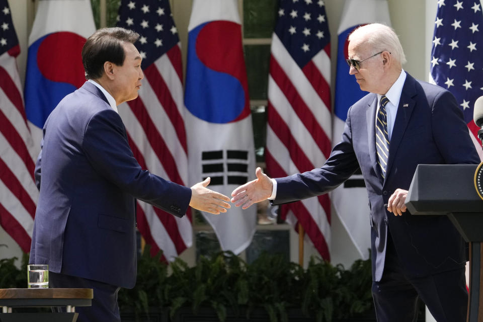 FILE - U.S. President Joe Biden, right, and South Korea's President Yoon Suk Yeol shake hands during a news conference in the Rose Garden of the White House, on April 26, 2023, in Washington. North Korea’s recent escalation of threats and endless tests of weapons aimed toward South Korea haven't done much to upset the calm in Seoul. Residents in the South's capital feel they've seen it all before and it's North Korea's way of getting attention in an election year for South Korea and the U.S. (AP Photo/Andrew Harnik, File)