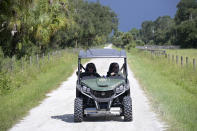 Florida Fish and Wildlife Commission officers ride up a private road near the entrance of the Carlton Reserve during a search for Brian Laundrie, Tuesday, Sept. 21, 2021, in Venice, Fla. Laundrie is a person of interest in the disappearance of his girlfriend, Gabrielle "Gabby" Petito. (AP Photo/Phelan M. Ebenhack)