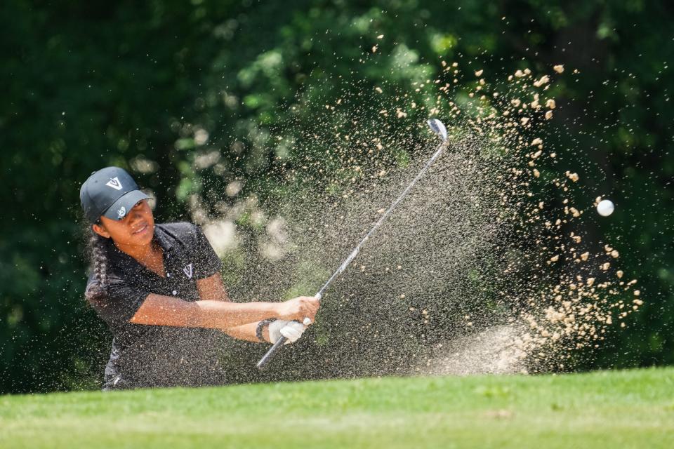 Vandegrift's Danica Lundgren hits out of the bunker during the final day of the Class 6A girls UIL state golf tournament at White Wing Golf Club in Georgetown on May 7.