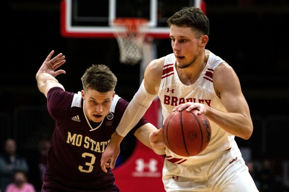 Bradley's Ville Tahvanainen takes the ball downcourt as Missouri State's Isaac Haney chases him during the Missouri Valley Conference game in Carver Arena on Jan. 5, 2022. The Bears beat the Braves 71-69 with a buzzer beating 3-point shot.