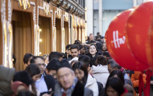 Customers queue outside Harrods in Knightsbridge 