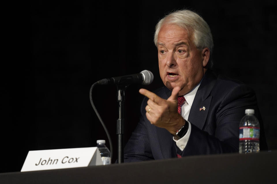 In this Aug. 17, 2021 file photo Republican gubernatorial candidate John Cox, right, responds to a question during a debate held by the Sacramento Press Club in Sacramento, Calif. Cox is running to replace Democratic Gov. Gavin Newsom in the Sept. 14 recall election. Democrats hope hope they can keep Newsom in office by driving up turnout.(AP Photo/Rich Pedroncelli, File)