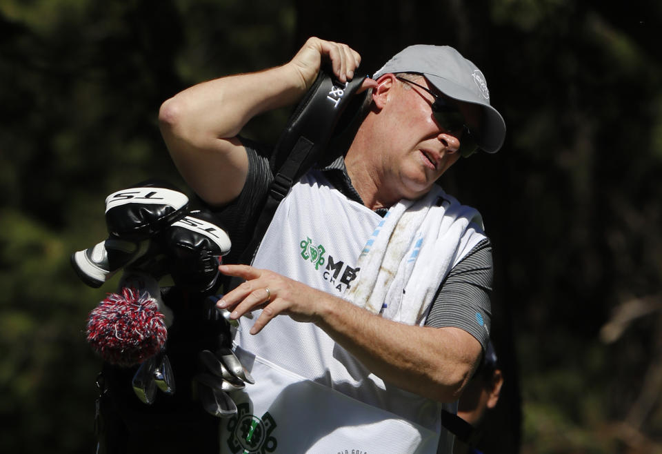 Shawn Spieth caddies for his son Jordan Spieth, during the first day of competition of the WGC-Mexico Championship at the Chapultepec Golf Club in Mexico City, Thursday, Feb. 21, 2019. Spieth’s father caddied nine holes of practice Wednesday and will be on the bag the rest of the week after Spieth's caddie left because of the death of his father. (AP Photo/Marco Ugarte)