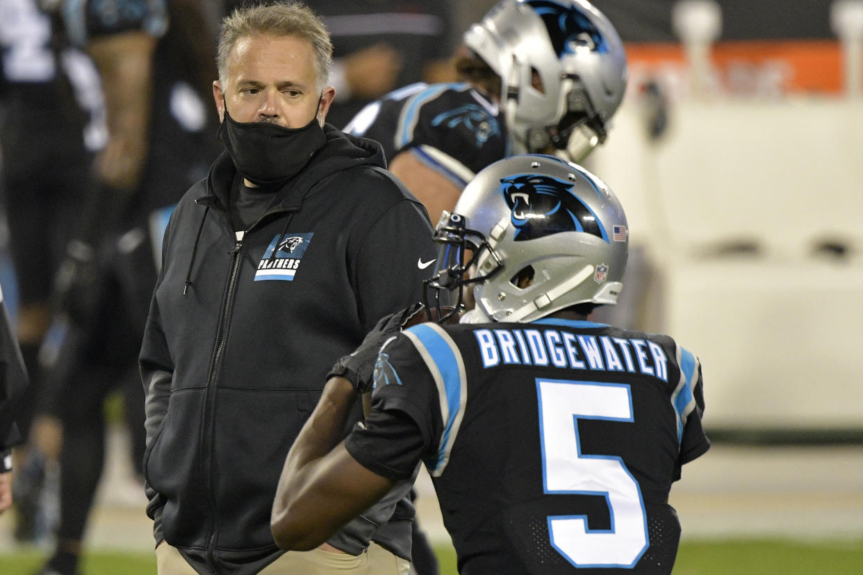 CHARLOTTE, NORTH CAROLINA - OCTOBER 29: Head coach Matt Rhule of the Carolina Panthers watches Teddy Bridgewater #5  during warm ups against the Atlanta Falcons at Bank of America Stadium on October 29, 2020 in Charlotte, North Carolina. (Photo by Grant Halverson/Getty Images)