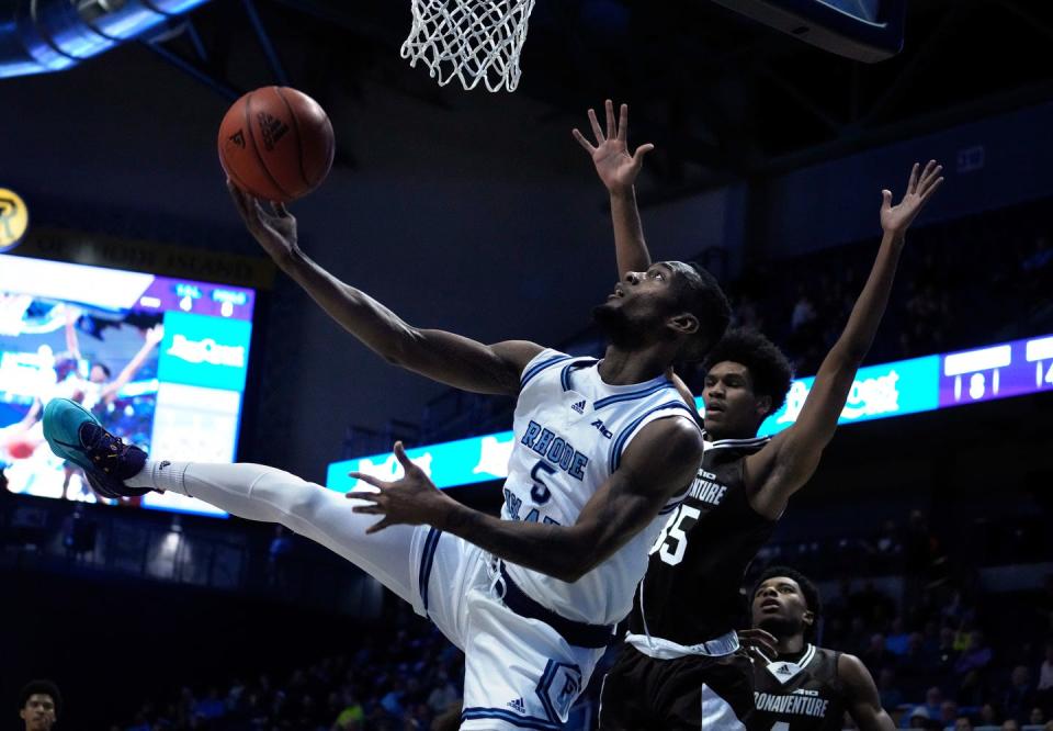 URI guard Jalen Carey underhands a shot to the Rams hoop during first half action against St. Bonaventure in men's basketball on Jan. 11, 2023 at the Ryan Center.