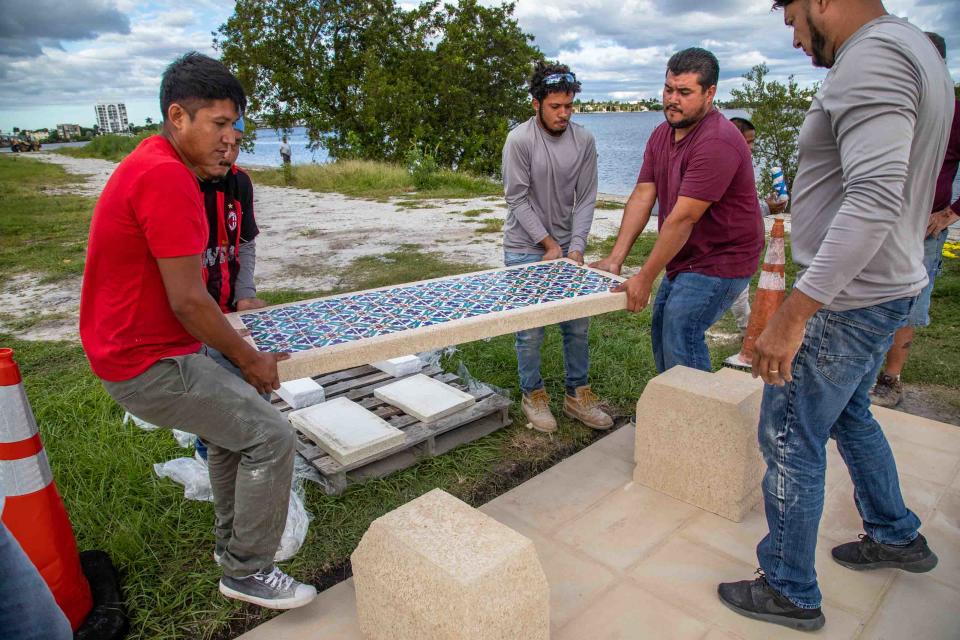 On Oct. 19, contractors install a section of the Marjorie Post Causeway Memorial.