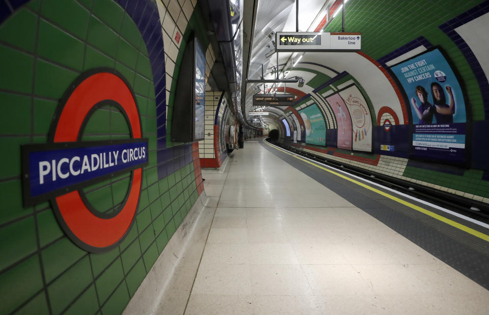 An empty platform at Piccadilly Circus tube station in London, Friday, March 20, 2020. For most people, the new coronavirus causes only mild or moderate symptoms, such as fever and cough. For some, especially older adults and people with existing health problems, it can cause more severe illness, including pneumonia. (AP Photo/Frank Augstein)