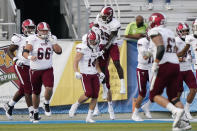 Troy wide receiver Tyler Hussey (14) is congratulated after scoring a touchdown against Middle Tennessee in the second half of an NCAA college football game Saturday, Sept. 19, 2020, in Murfreesboro, Tenn. Troy won 47-14. (AP Photo/Mark Humphrey)