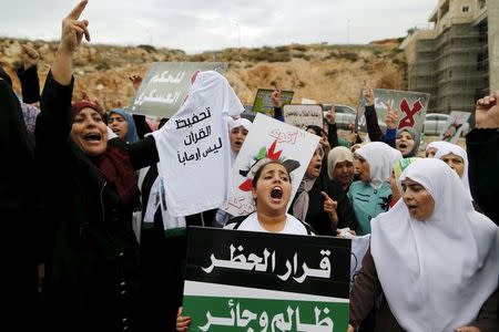 Israeli Arab women protesters shout slogans during a demonstration against the outlawing of the Islamic Movement's northern branch, in the northern Israeli-Arab town of Umm el-Fahm November 28, 2015. REUTERS/Ammar Awad