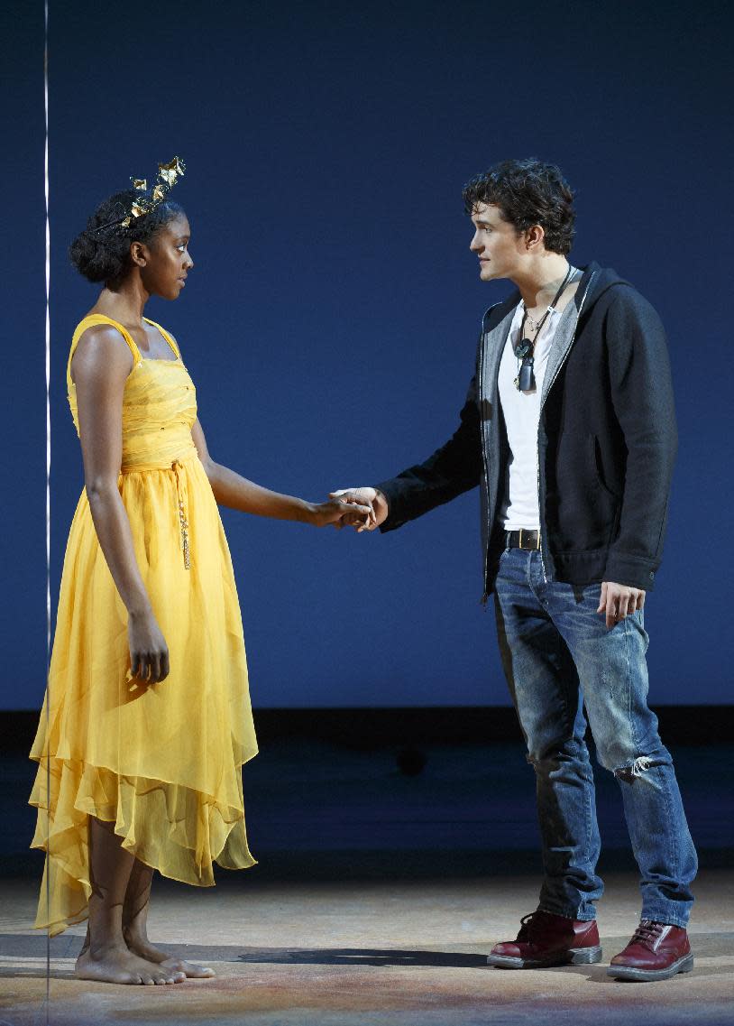 This theater image released by The Hartman Group shows Condola Rashad, left, and Orlando Bloom during a performance of "Romeo and Juliet," in New York. (AP Photo/The Hartman Group, Carol Rosegg)