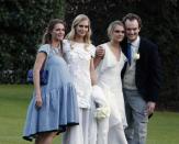 <p>Cara Delevingne was one of 17 bridesmaids for her sister <a href="https://www.theknot.com/content/10-surprising-facts-about-poppy-delevingnes-wedding-including-ring-bearers-dressed-like-actual-bears" rel="nofollow noopener" target="_blank" data-ylk="slk:Poppy’s wedding in 2014;elm:context_link;itc:0;sec:content-canvas" class="link ">Poppy’s wedding in 2014</a>. Cara wore a flowy white dress perfect for the May weather.</p>