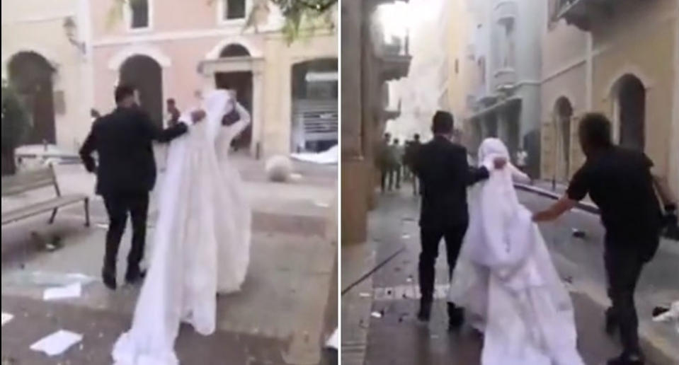 Israa Seblani in her wedding dress as she hurries away in the aftermath of the Beirut blast.