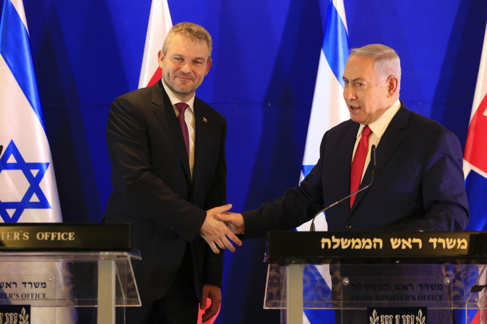 Prime Minister of Slovakia Peter Pellegrini, left, shake hands with Israeli Prime Minister Benjamin Netanyahu after their meeting in Jerusalem, Tuesday, Feb. 19, 2019. (AP Photo/Ariel Schalit, Pool)