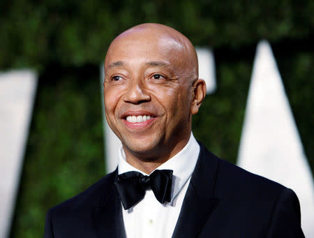 FILE PHOTO: Def Jam co-founder Russell Simmons arrives at the 2010 Vanity Fair Oscar party in West Hollywood, California, U.S. March 7, 2010. REUTERS/Danny Moloshok/File Photo