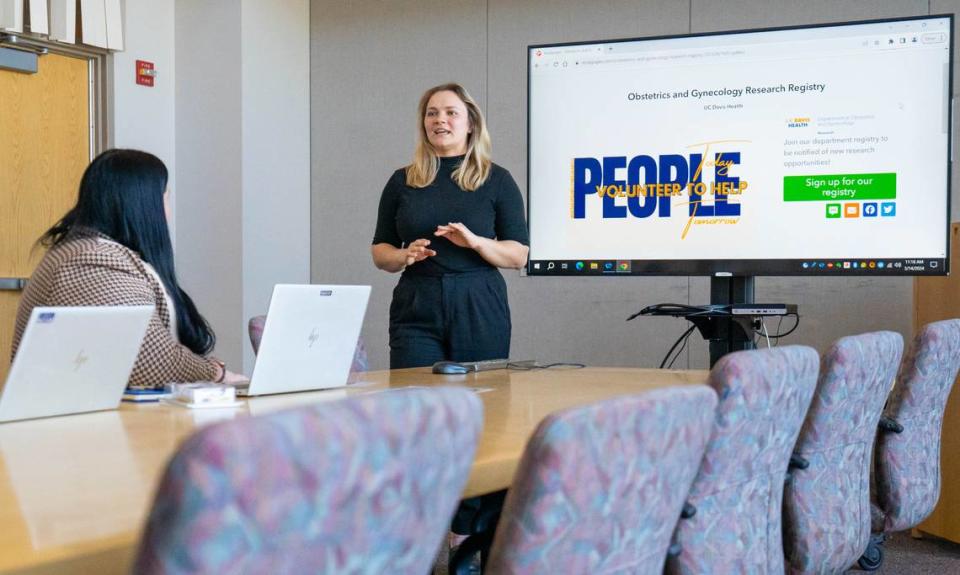 Alina Patrikeyva, an assistant clinical research coordinator with UC Davis Health, leads a team meeting inside of the UC Davis Health Lawrence J. Ellison Ambulatory Care Center on Thursday.