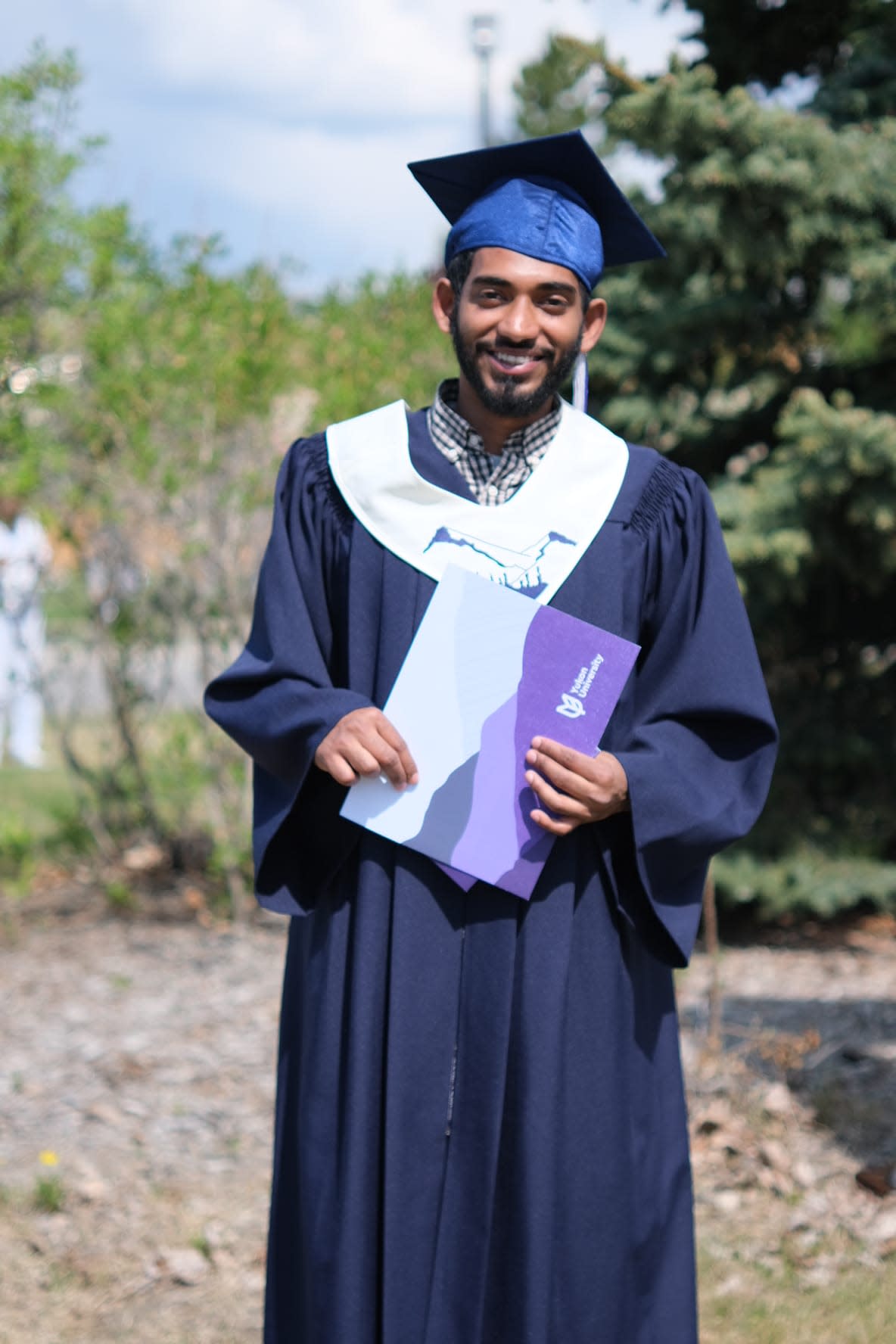 Christy Sibi graduated from the university's Northern Sciences program in 2022. He says the 'sudden stop' to the nominee program is a big disadvantage for international students. (Submitted by Christy Sibi - image credit)