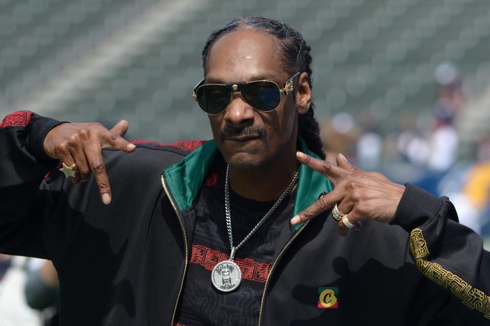 Music artist Snoop Dogg gestures before a 2019 game between the Houston Texans and Los Angeles Chargers.