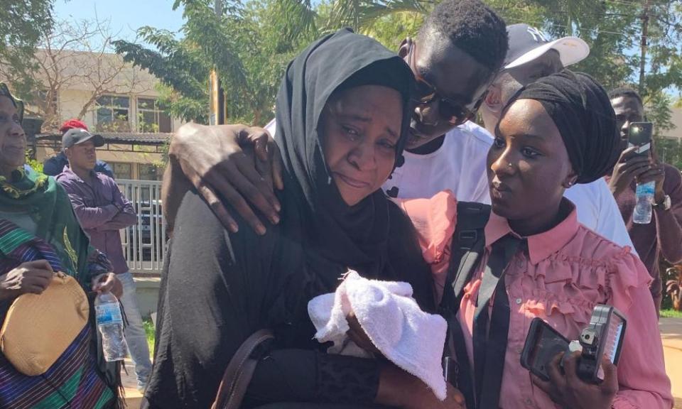 Families mourn in Banjul after Gambia’s justice ministry handed over the remains of former soldiers who were killed in a coup bid against former ruler Yahya Jammeh in 2014