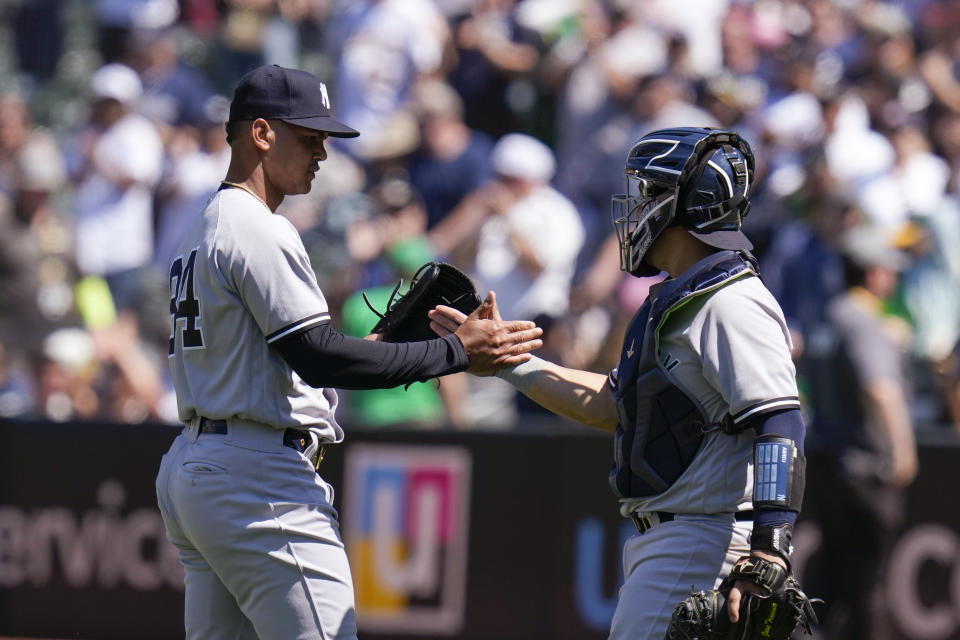 New York Yankees pitcher Albert Abreu, left, celebrates with catcher Jose Trevino after the team's 10-4 victory over the Oakland Athletics in a baseball game in Oakland, Calif., Thursday, June 29, 2023. (AP Photo/Godofredo A. Vásquez)