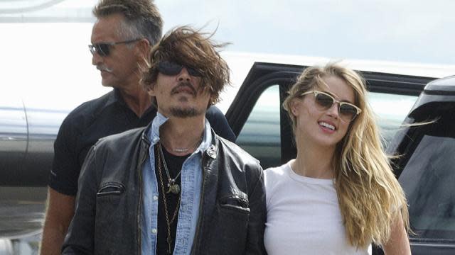 What split? Johnny Depp and Amber Heard held hands in Brisbane, Australia on Monday, putting on a united front in the face of rumors that the two were already headed towards a split after tying the knot in February. <em>People</em> also reported on Monday that the two were leading "separate lives," but has since deleted the post. Johnny, 51, and Amber, 28, however, proved that they're still very much together, showing some PDA in Australia where Johnny's filming <em>Pirates of the Caribbean: Dead Men Tell No Tales</em>. This is the first time the two have been photographed together since their wedding. Splash News PHOTOS: Sweetest Celebrity PDA "They've always been together," a source explains to E! News. "They travel for work then come home. They live together and are very much in love, despite what's being said about breakup rumors." "They are very much in love with each other, but because of their strong personalities and opinions, they do argue a lot," an insider adds. Regardless of any supposed marital drama, the two looked every bit the movie stars that they are on Monday, Amber managing to stun in just a pair of high-waist jeans and a simple white t-shirt. Meanwhile, Johnny sported his usual rocker look, sporting disheveled hair, a leather jacket and multiple necklaces. Splash News VIDEO: Johnny Depp's 15-Year-Old Daughter Lily-Rose Depp Is All Grown-Up in a Crop Top Check out the video below to hear Johnny admit he'd like to have "100" more kids with Amber, in addition to his two children with his ex Vanessa Paradis, Lily-Rose, 15, and Jack, 13.