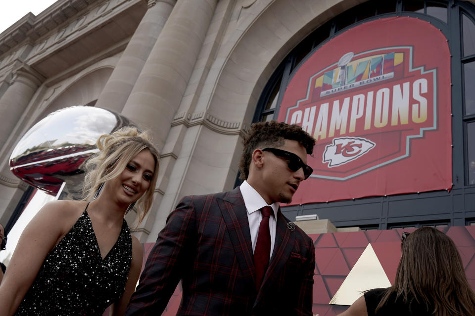 Kansas City Chiefs quarterback Patrick Mahomes and his wife Brittany arrive at a ceremony for team members to receive their championship rings for winning NFL football's Super Bowl LVII, Thursday, June 15, 2023, in Kansas City, Mo. (AP Photo/Charlie Riedel)