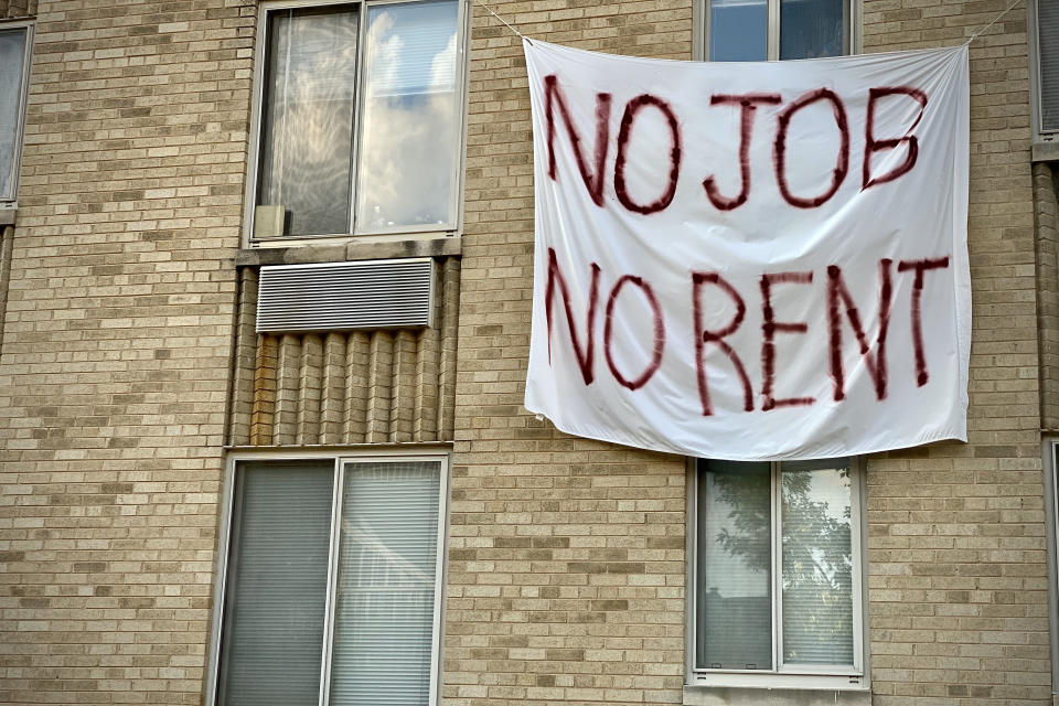 A banner against renters eviction reading no job, no rent is displayed on a controlled rent building in Washington, DC on August 9, 2020. (Photo by ERIC BARADAT/AFP via Getty Images)