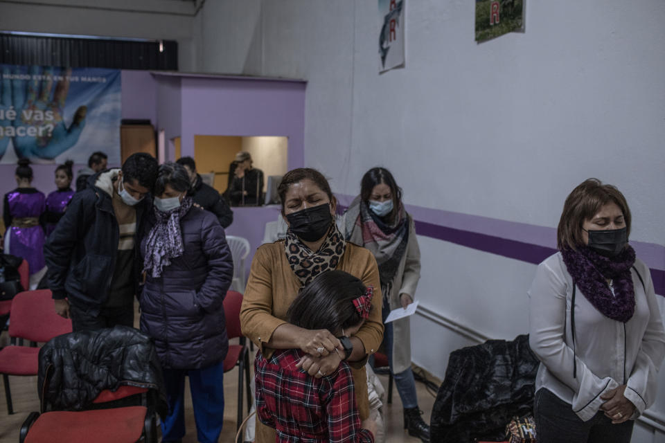 Latin-American parishioners pray during a Sunday Mass at the Pentecostal church in Salamanca, Spain, on Sunday, Dec. 5, 2021. The steady growth of the Protestant population coincides with a steady drop in the number of churchgoing Catholics. (AP Photo/Manu Brabo)