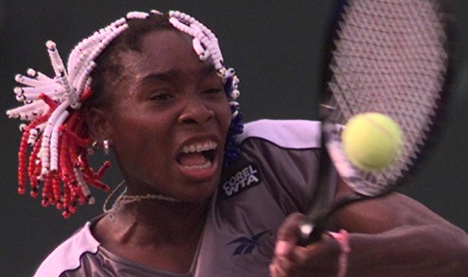 In 1997 at the Lipton, Venus Williams returns a volley vs. Martina Hingis.