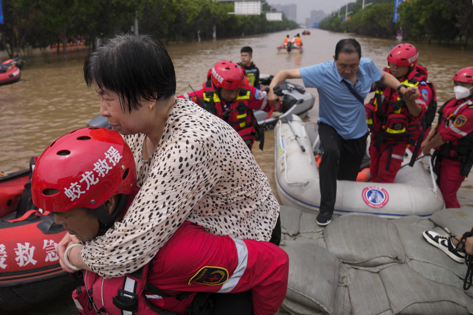 Rescuers evacuate residents with rubber boats through floodwaters in Zhuozhou in northern China's Hebei province, south of Beijing, Wednesday, Aug. 2, 2023. China's capital has recorded its heaviest rainfall in at least 140 years over the past few days. Among the hardest hit areas is Zhuozhou, a small city that borders Beijing's southwest. (AP Photo/Andy Wong)