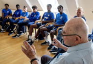 CORRECTS SPELLING OF NAME TO SHAUL PAUL LADANY INSTEAD OF SHAUL PAUL LADY - Holocaust survivor Shaul Paul Ladany talks to youth players of FC Chelsea in Nuremberg, Germany, Friday, July 29, 2022. Some of Europe's best young soccer players from the under-17 teams of Chelsea, Bayern Munich, Bologna and other international clubs contest the Walther Bensemann Memorial Tournament in Nuremberg, where they also learn the dangers of intolerance by meeting Holocaust survivors, attending workshops and taking part in excursions. (AP Photo/Michael Probst)