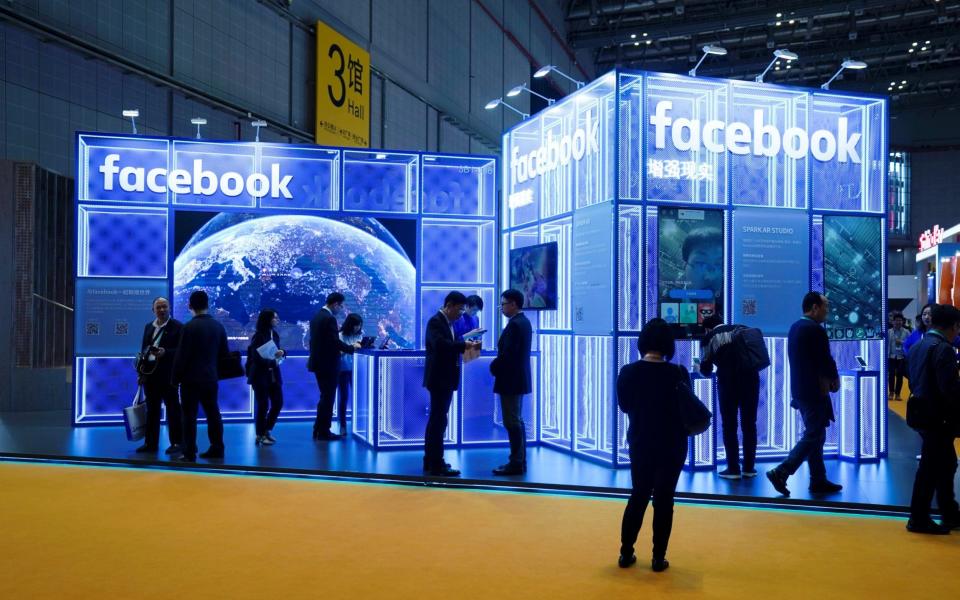 Facebook signs are seen during the China International Import Expo (CIIE), at the National Exhibition and Convention Center in Shanghai - REUTERS