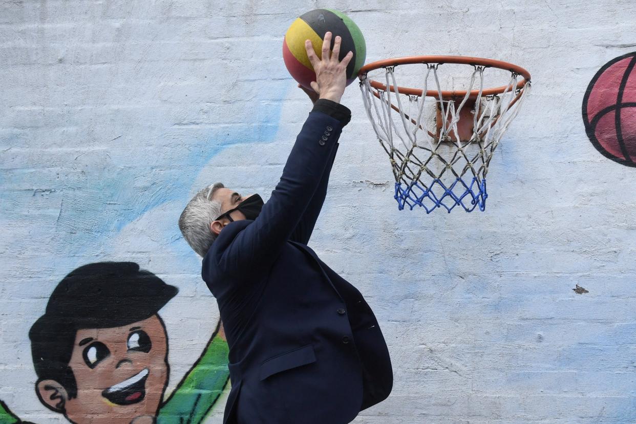 <p>Sadiq Khan played basketball with Ed Milliband at a play centre in Camden after launching his manifesto</p> (Jeremy Selwyn)