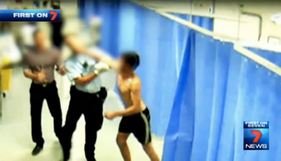 Shockingly one patient punches a police officer in the face. Photo: 7 News