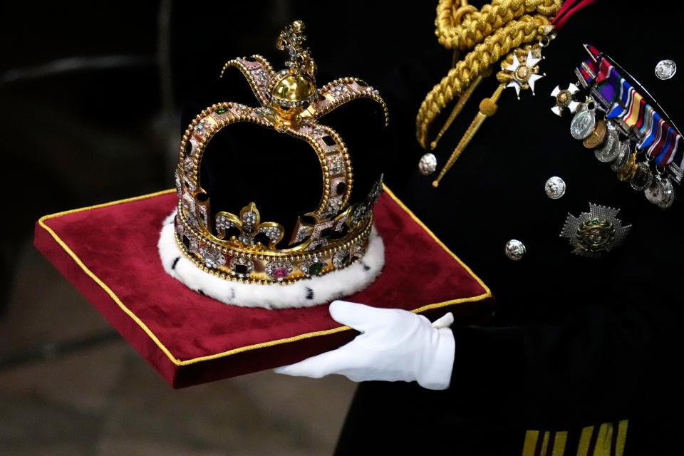 St Edward's Crown is carried during the coronation ceremony of Britain's King Charles III at Westminster Abbey in London Saturday, May 6, 2023.