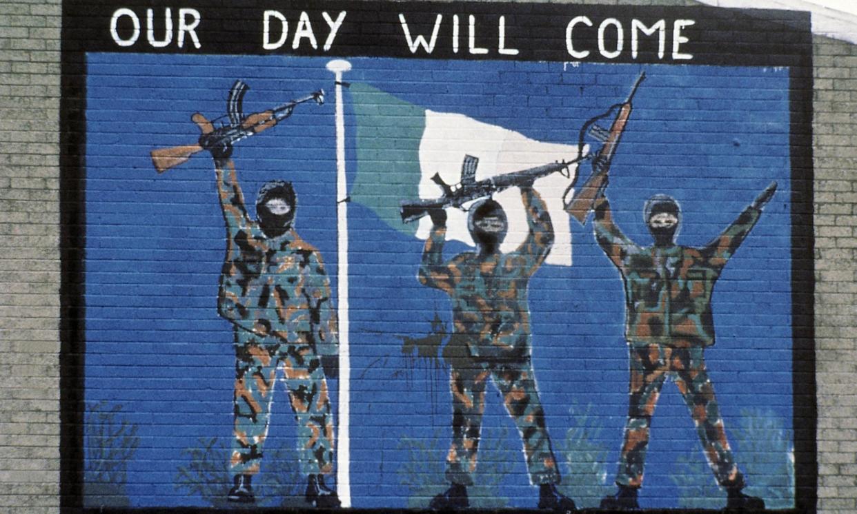 <span>A pro-IRA mural in Belfast. Over 70% of murders during the Northern Irish troubles were carried out by paramilitaries.</span><span>Photograph: Peter Kemp/AP</span>