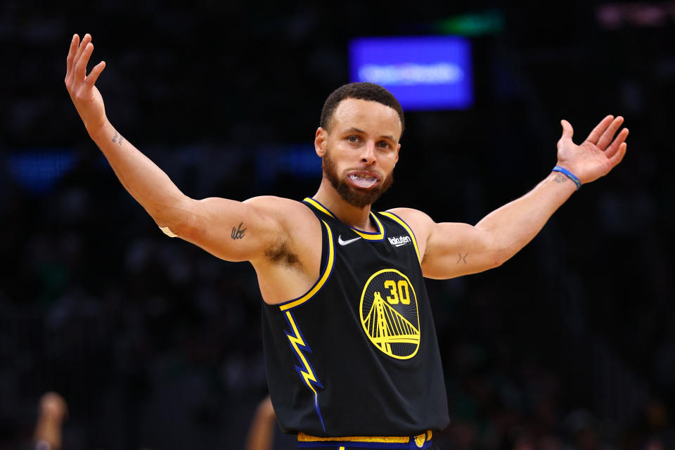 Golden State Warriors star Stephen Curry celebrates against the Boston Celtics during Game 4 of the 2022 NBA Finals at TD Garden in Boston on June 10, 2022. (Elsa/Getty Images)
