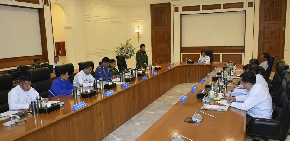 In this photo released from the The Military True News Information Team on Nov. 8, 2023, Senior Gen. Min Aung Hlaing, center left, chairman of State Administration Council, speaks during a meeting with members the National Defense and Security Council including Myint Swe, center, acting President of the military government, in Naypyitaw, Myanmar. The head of Myanmar’s military government has charged that a major offensive in the country’s northeast by an alliance of armed ethnic minority organizations was funded in part by profits earned by one of the groups from the region's lucrative drug trade, state-controlled media reported Thursday. (The Military True News Information Team via AP)