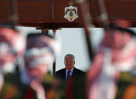 Palestinian President Mahmoud Abbas stands on podium during a reception ceremony at the Queen Alia International Airport in Amman, Jordan March 28, 2017. REUTERS/Muhammad Hamed