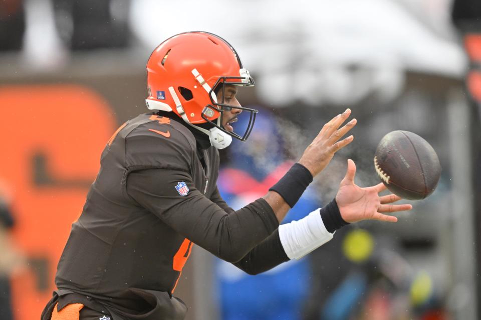 Browns quarterback Deshaun Watson takes the snap during the first half against the Saints, Saturday, Dec. 24, 2022, in Cleveland.