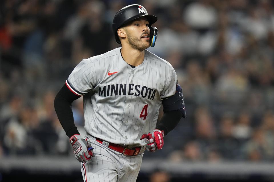 Minnesota Twins' Carlos Correa watches his home run against the New York Yankees during the sixth inning of a baseball game Friday, April 14, 2023, in New York. (AP Photo/Frank Franklin II)