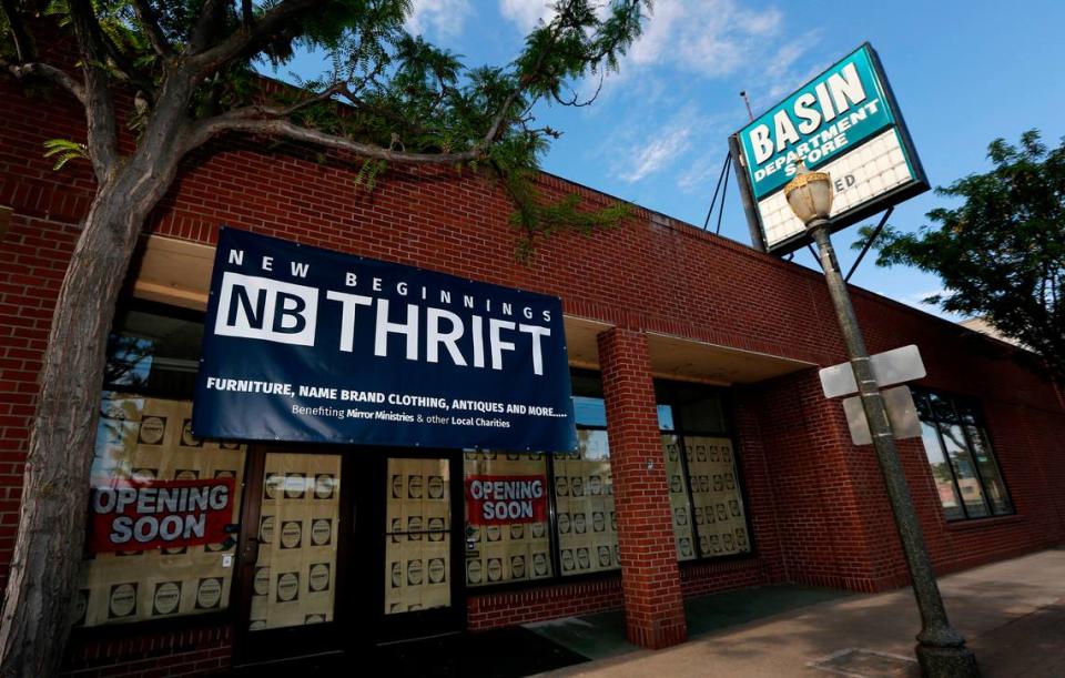 A banner advertises for New Beginnings Thrift to open soon in the former Basin Department Store building on West First Avenue in downtown Kennewick.