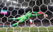 <p>Croatia’s Danijel Subasic saves the first penalty attempt in the shootout from Christian Eriksen </p>