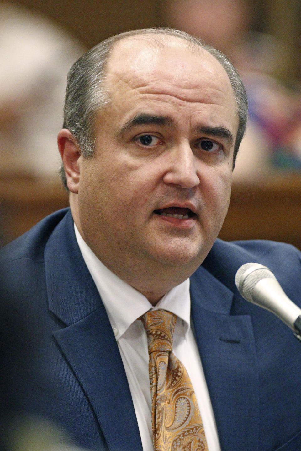 FILE - In this Sept. 7, 2016 file photo, John Davis, then executive director of the Mississippi Department of Human Services, answers lawmakers questions at a hearing at the Capitol in Jackson, Miss. Special agents from the office of State Auditor, have arrested Davis, and several others in connection with a multi-million dollar embezzlement scheme. The indictments include a range of violations involving fraud and embezzlement. (AP Photo/Rogelio V. Solis, File)