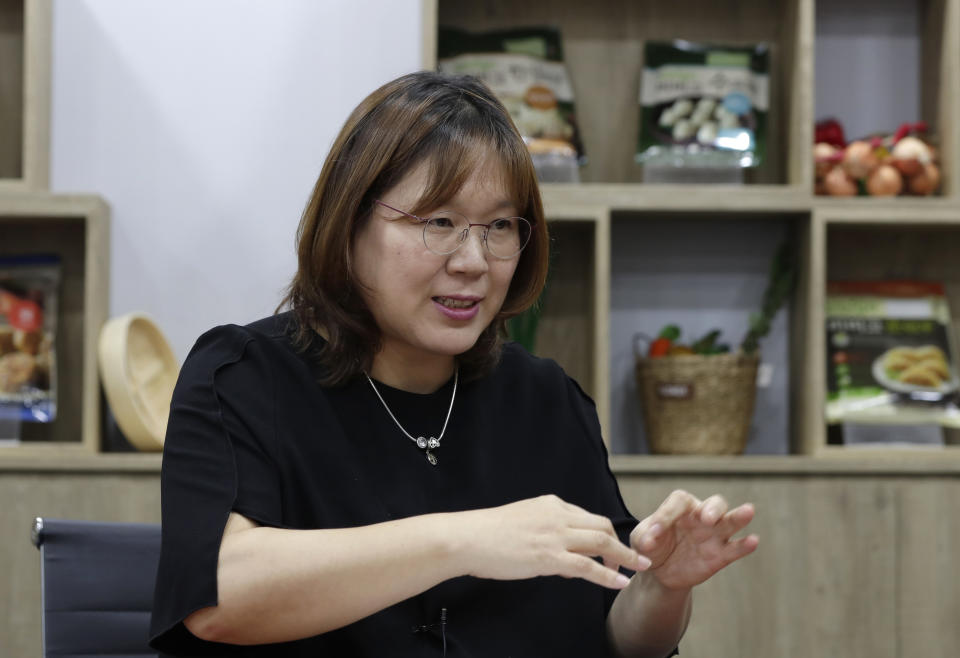 In this July 18, 2018, photo, Cho Gun Ae, a dumpling researcher at CJ CheilJedang Corp., gestures during an interview at CJ's Bibigo dumpling factory in Incheon, South Korea. South Korea’s largest food company is making a multimillion-dollar bet on “mandu,” developing its own machines to automate the normally labor-intensive production of the Korean dumpling and building factories around the world.(AP Photo/Lee Jin-man)